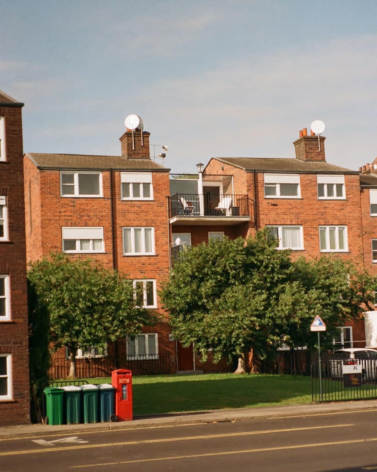A council housing block on a quiet residential street.