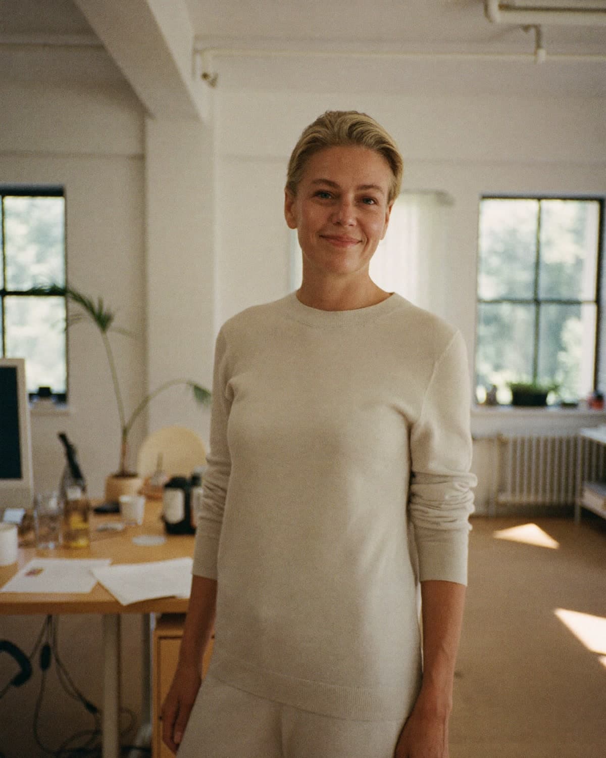 A compliance lead in a bright, open office.